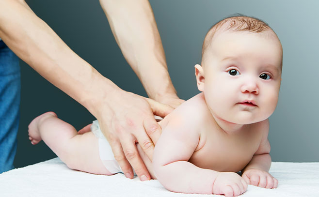 Baby receiving chiropractic care