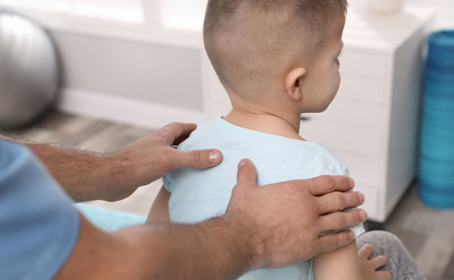 Boy receiving chiropractic care